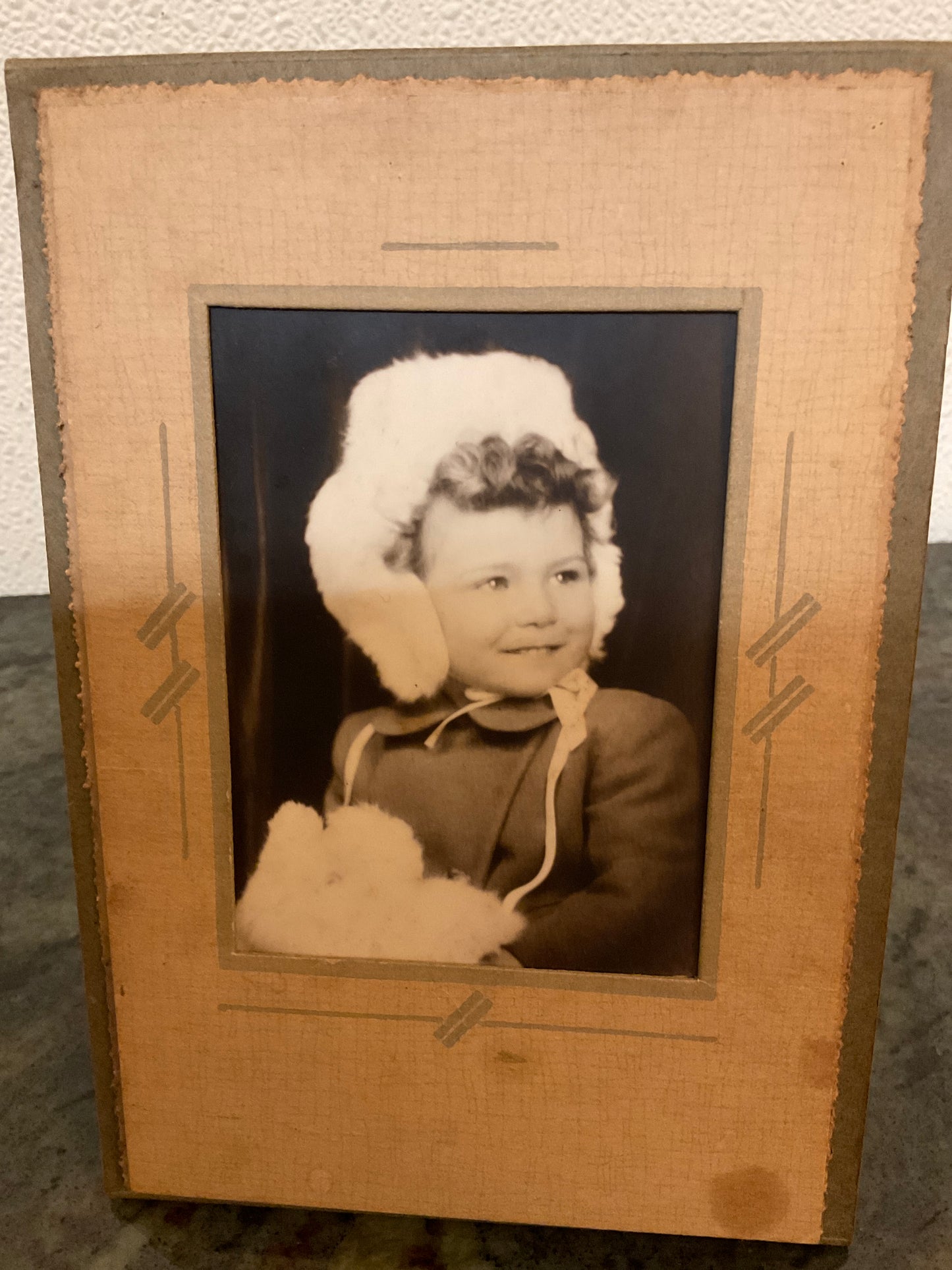 Folding Portrait Child In Winter Muffs