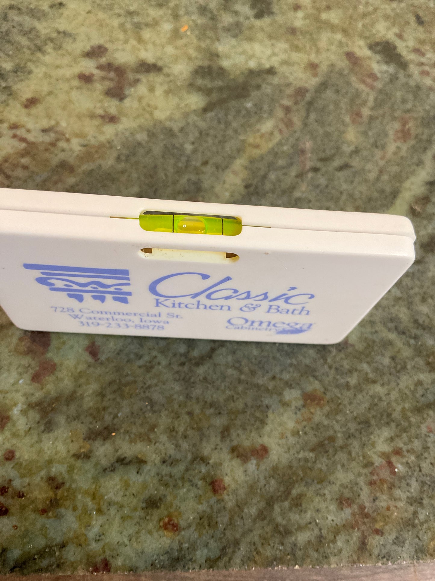Omega Cabinetry Tape Measure/ Level Advertising