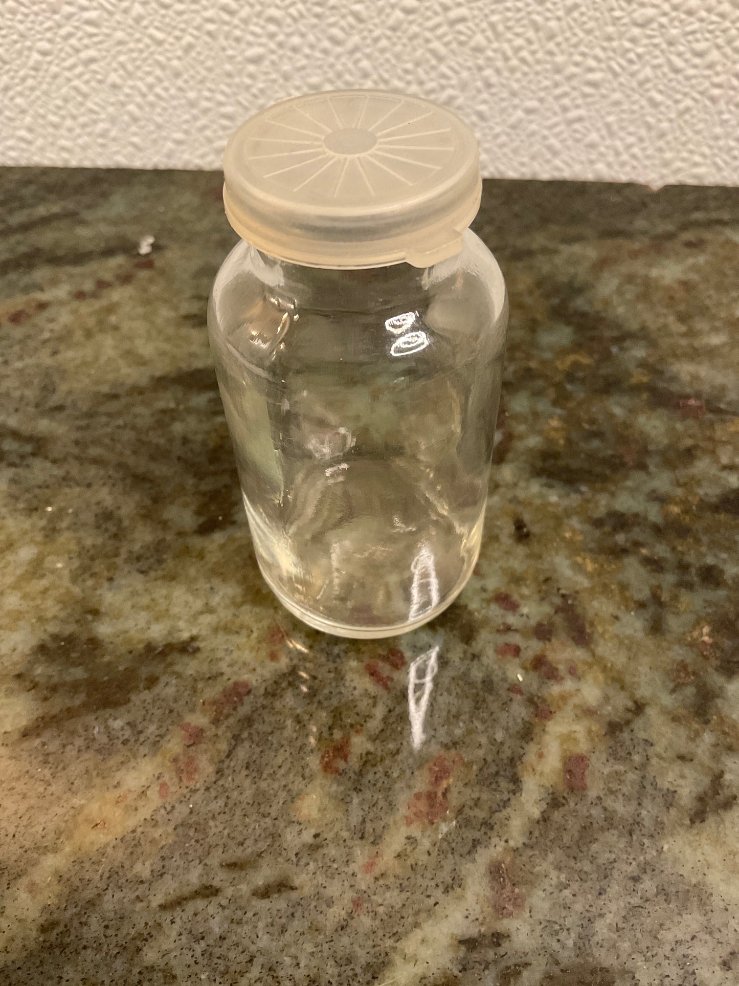 Small glass bottle with lid