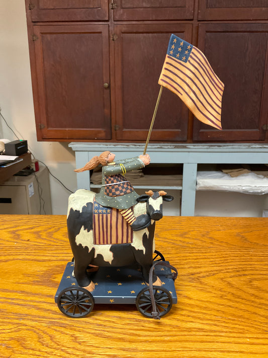 WilliRaye American Flag Girl on Cow