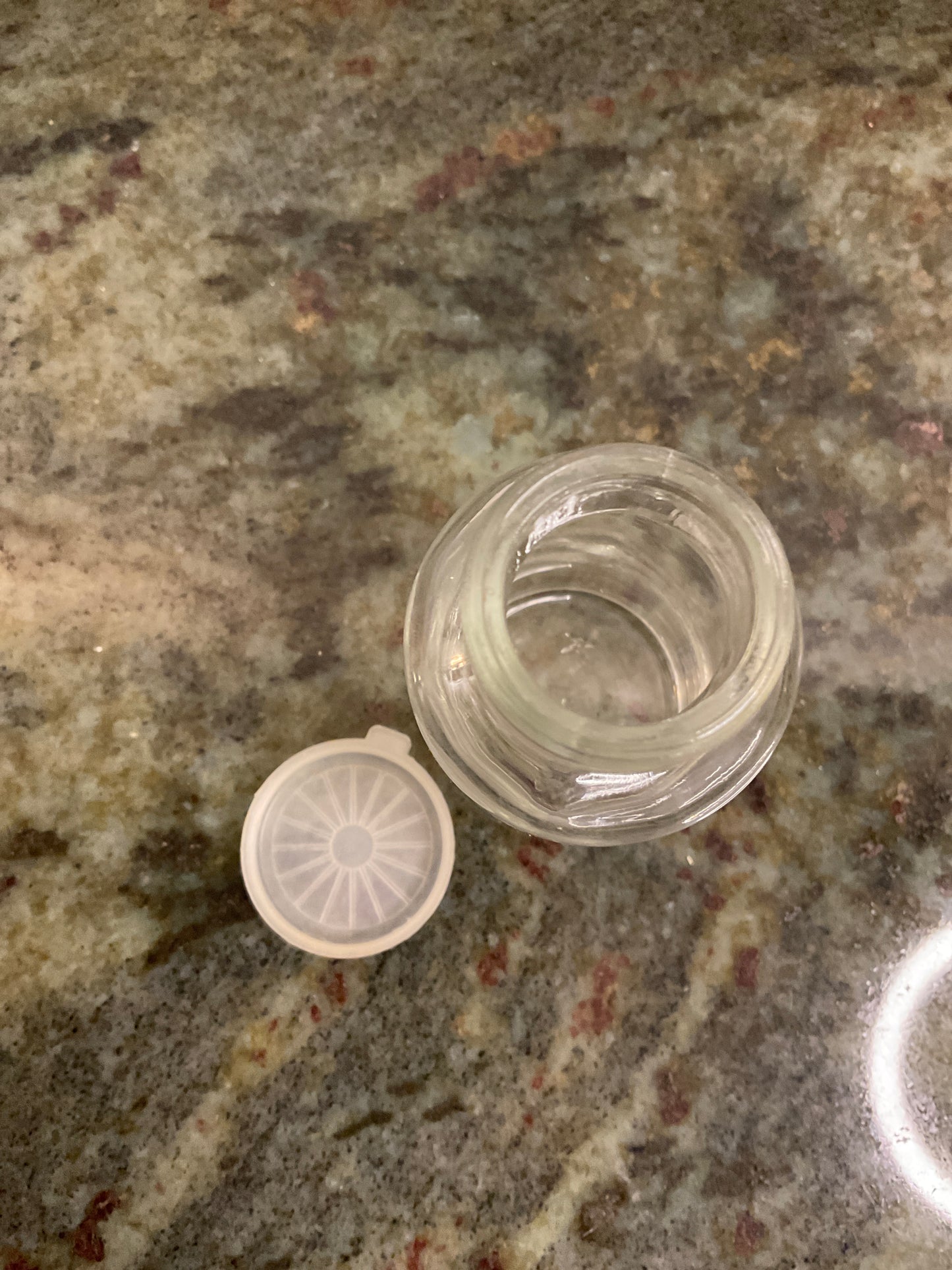Small glass bottle with lid