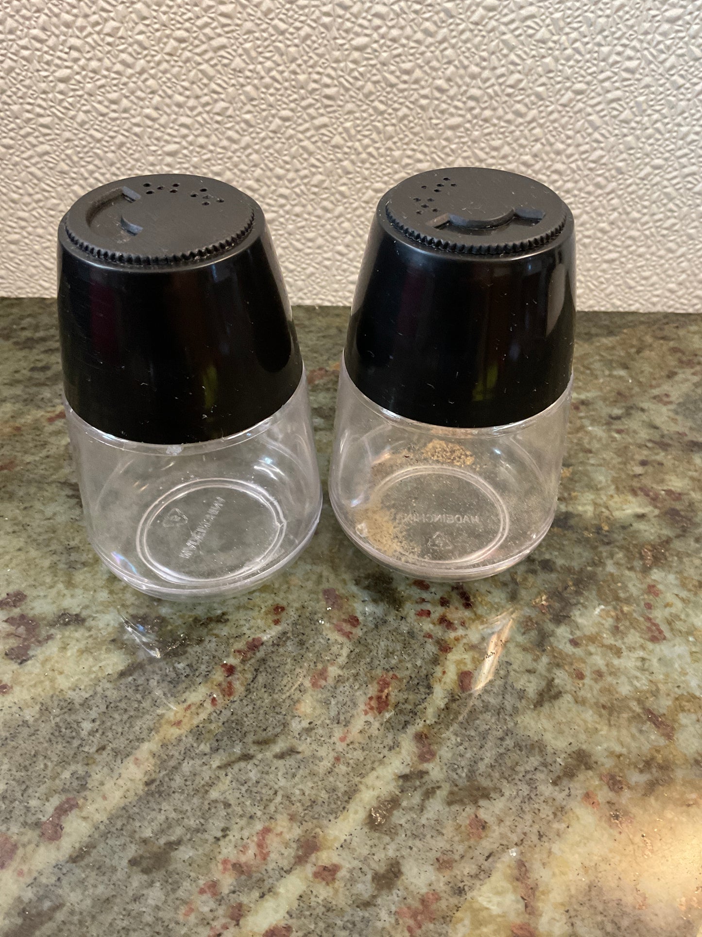 Vintage Clear and Black Plastic Salt and Pepper Shakers