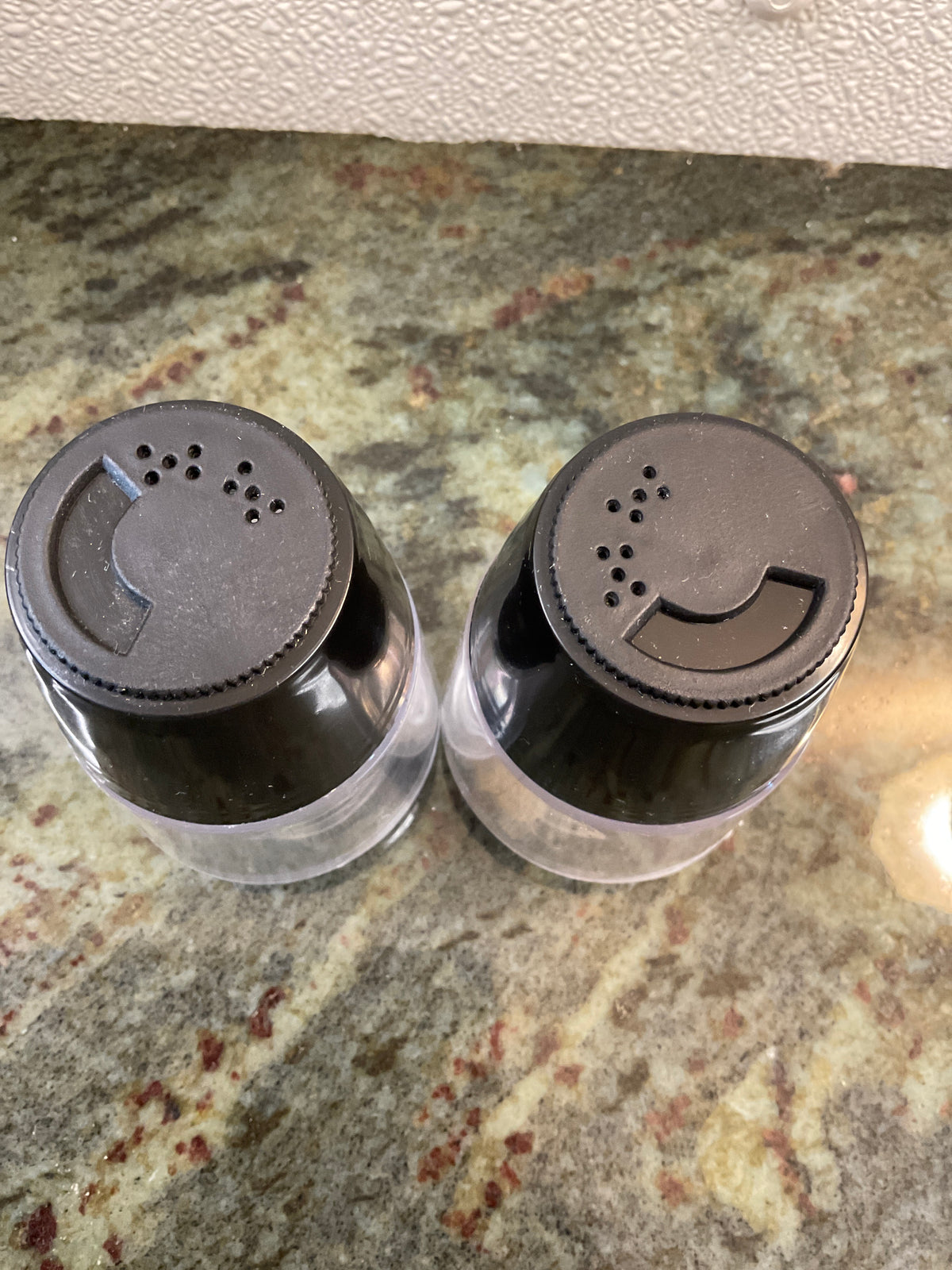 Vintage Clear and Black Plastic Salt and Pepper Shakers